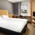 ibis London Thurrock M25 room with twin beds and a window view of the London Eye