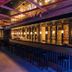 Signature Blue Resort Kusadasi bar lounge with long counter, hanging lights and stools in Kusadasi