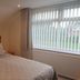 Grove House Hotel, Woodbridge: bright guest room with double bed and large window with vertical blinds