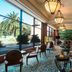 Sheraton Pilar Hotel & Convention Center lobby with lounge seating, bar, and large garden-view windows in Pilar