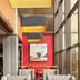 Sheraton Suites Akron Cuyahoga Falls lounge with high ceilings, large windows, and colorful modern seating