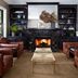 Gaige House in Glen Ellen lounge with leather armchairs, fireplace, and built-in shelves