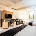 168 Motel-Hsinchu in Hsinchu City: modern room with two beds, desk, TV and window seating