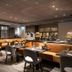 Bilderberg Hotel 't Speulderbos in Garderen dining room with booth seating and wine display