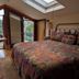 Ann Arbor Bed and Breakfast room with skylight, balcony doors, and tree views in Ann Arbor