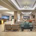 Hilton Washington DC/Rockville Executive Meeting Center lobby seating area in Rockville with modern chandeliers