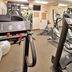 Candlewood Suites Junction City Fort Riley fitness center with treadmills, ellipticals and wall mirror