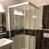 Stadt Hamburg Saarbruecken bathroom with glass shower, sink and toilet