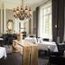 Landgoed Lauswolt restaurant in Beetsterzwaag with elegant chandeliers and white table settings