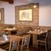 Hotel Landgasthof Hohenauer Hof dining room in Hohenau with wooden tables and patterned benches