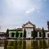 Grand Daira Hotel Palembang in Palembang with a fountain and mosque-inspired exterior by the water