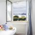 Hôtel Spa De La Citadelle Lorient room with open window overlooking Port-Louis harbor