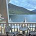 Hofslund Fjord Hotel in Sogndal balcony seating with fjord and mountain view