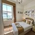 Riviera Lodge Hotel Torquay guest room with double bed, window view and desk