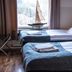 Reimersholme Hotel in Stockholm room with two single beds and a sailboat model by the window