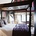 The White Swan Hotel in Stratford-upon-Avon bedroom with four-poster bed, patterned pillows and canopy
