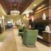 Hampton Inn & Suites Raleigh-Durham Airport-Brier Creek lobby with seating, fireplace and front desk in Raleigh