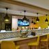 Town Lodge Menlo Park in Pretoria bar area with yellow stools and patterned counter