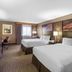 DoubleTree by Hilton Downtown Wilmington - Legal District guest room with two beds and desk