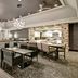 Homewood Suites by Hilton Burlington lobby lounge with seating and bar area