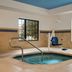 TownePlace Suites by Marriott Williamsport indoor pool and hot tub area with seating