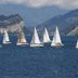 Concept Village Piccola Gardiola in San Felice del Benaco with sailboats on the lake and mountains beyond