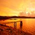 Gateway Chikmagalur in Chikamagalur with a lakeside pier at sunset and golden sky