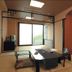 Motoyu No Yado Kurodaya in Beppu: traditional tatami room with low table and sliding glass doors