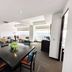 Hotel Stadium in León dining area with table seating and city views through large windows