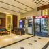 Grand View International Hotel in Liaoyang lobby seating area with beverage coolers and ATM