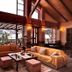 Vitina House in Vytina living room with large windows, wood beams, sofas and mountain views