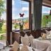Landhotel Binderhäusl Garni dining room with large windows and mountain views in Inzell