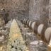 Hotel Boutique Casareyna Puebla City dining table in stone-walled room with white floral centerpiece