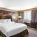 DoubleTree by Hilton Downtown Wilmington - Legal District guest room with king bed and city-view window