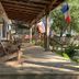 Blue Moon Guest House in Lafayette: covered porch with rocking chairs and flags