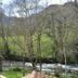 Alesga Rural in San Martín de Teverga with mountain and river views through the window