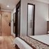 Yangjianhua Hotel (Shanghai Hu'nan) room in Shanghai with bed, vanity, mirror and entryway