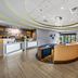 Holiday Inn Express & Suites Lakeland South lobby with front desk and seating area in Lakeland