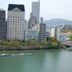 Hiroshima Ekimae Green Hotel in Hiroshima with river view, city buildings and distant hills
