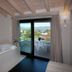 Hotel Porto Azzurro in Sirmione room with balcony, lake view, and whirlpool tub