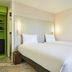 greet Hotel Versailles - Voisins Le Bretonneux twin room with two single beds and lime green shelving