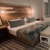 Diaz Hotel & Resort Mossel Bay guest room with king bed and balcony ocean sunset view