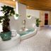 Fletcher Hotel-Restaurant De Klepperman spa area in Hoevelaken with tiled pool and curved reception counter