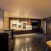 Hotel Mystays Premier Hamamatsucho lobby in Tokyo with marble floors, seating, and glass entrance