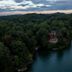 The Lodge on Lake Lure on Lake Lure, with a forested shoreline and calm water at dusk