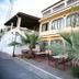 Hotel Company in Barcellona Pozzo di Gotto, 3-star hotel exterior with palm trees and outdoor seating