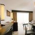 Hotel Tahiti Nui in Papeete: spacious suite with dining table, balcony doors, and bedroom view