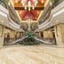 Jingland Exhibition Hotel in Xishuangbanna lobby with grand atrium, chandeliers and marble flooring