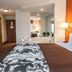 Sleep Inn & Suites Lake of the Ozarks in Camdenton guest room with king bed and soaking tub