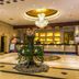 Grand View International Hotel, Liaoyang lobby with chandelier, reception desk, and central floral display
